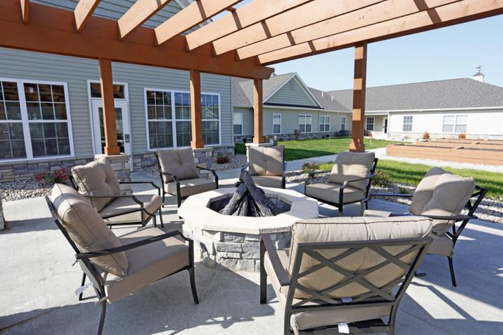 outdoor fire pit surrounded by chairs